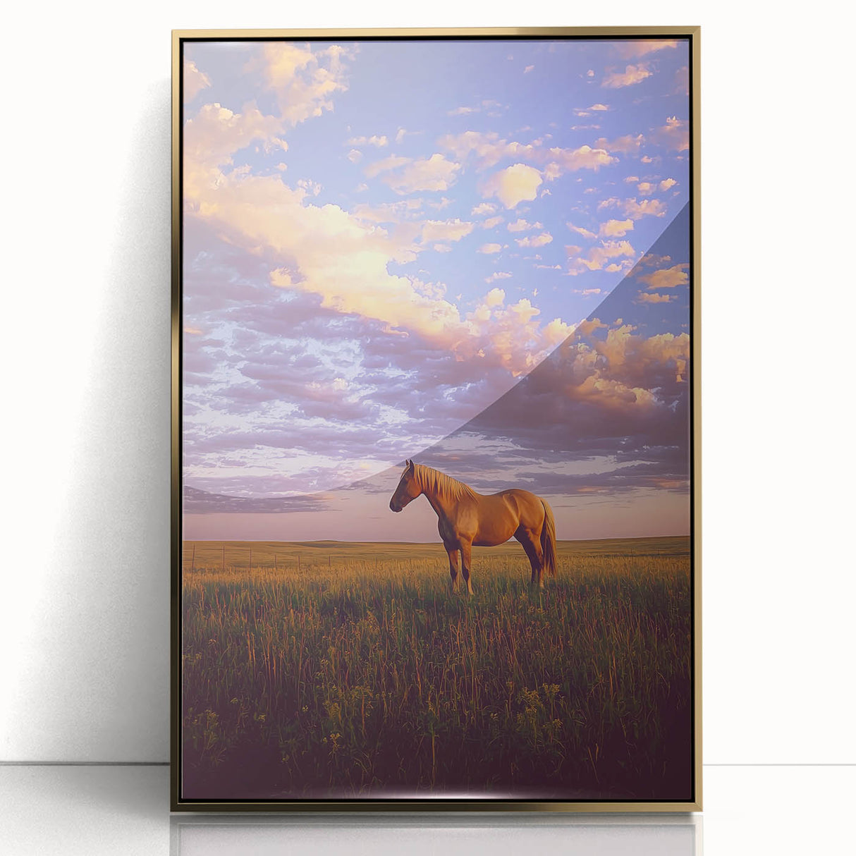 Framed acrylic artwork showcasing a serene countryside landscape, featuring lush green fields and a vibrant blue sky, elegantly presented in a gold frame.