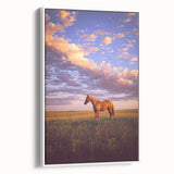 Framed canvas artwork depicting a serene countryside landscape, showcasing lush green fields and a bright blue sky, presented in a white frame for a modern aesthetic.