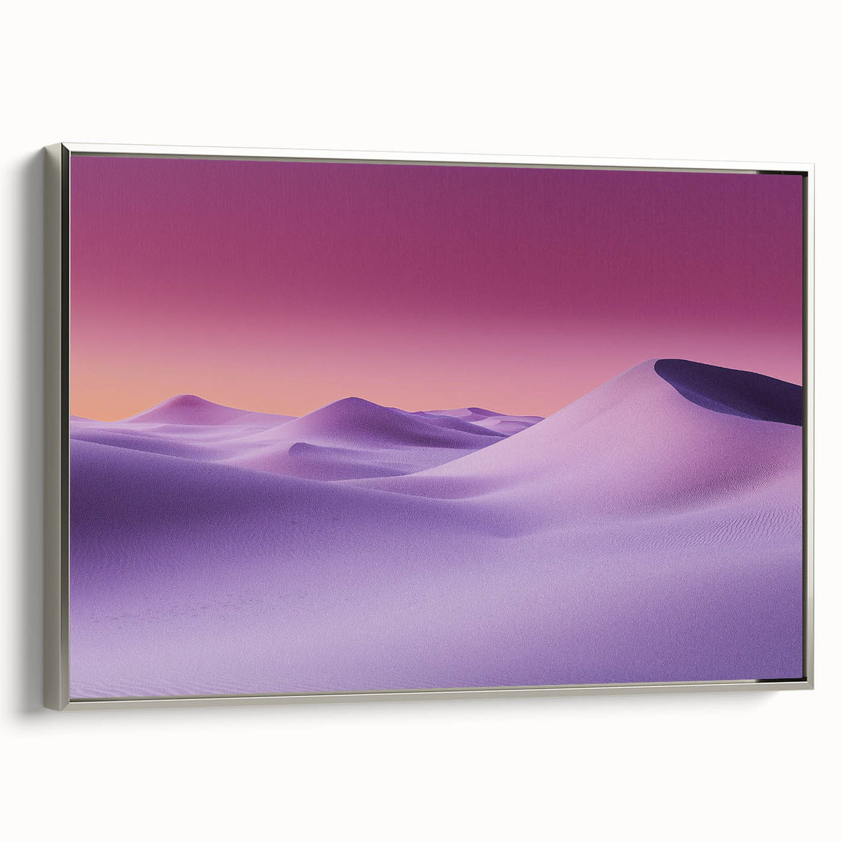 Framed canvas artwork showcasing a desert landscape with vibrant colors, featuring a sleek silver frame, ideal for modern home decor in living rooms or offices.