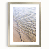 Textured abstract art print in silver frame, featuring swirling gray patterns, ideal for modern bedroom decor.
