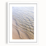Abstract art print featuring swirling blue and white patterns, framed in white, ideal for dining room decor.