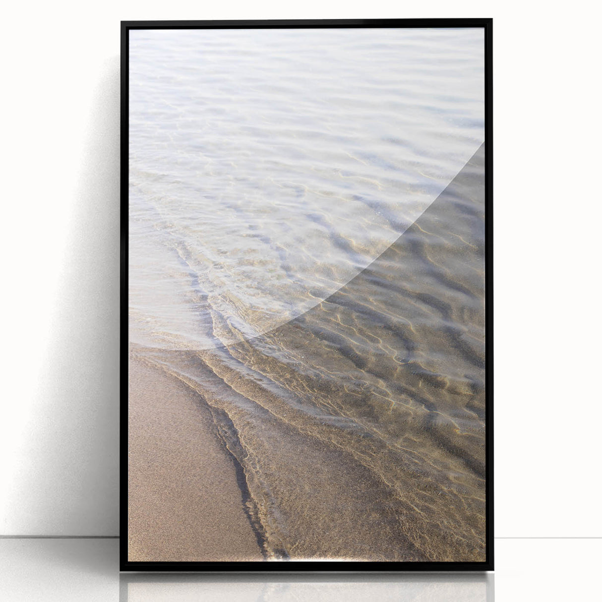 Large abstract wall art in muted earth tones on acrylic, framed in black, ideal for modern living room decor.