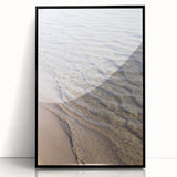Large abstract wall art in muted earth tones on acrylic, framed in black, ideal for modern living room decor.