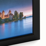 Close-up of a framed canvas artwork depicting a serene landscape with a majestic castle surrounded by lush greenery, showcasing vibrant colors and intricate details. Perfect for enhancing home decor with a touch of elegance.