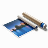 Rolled print showcasing a stunning landscape scene with a medieval castle surrounded by lush greenery, elegantly packaged in a protective cardboard tube. Ideal for home decor enthusiasts.