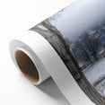 Rolled canvas showcasing a vibrant landscape design of a red barn surrounded by lush greenery, elegantly packaged in a durable cardboard tube for safe shipping.