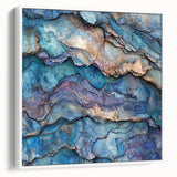 Framed landscape canvas featuring vibrant canyon artwork with rich earthy tones, showcasing a white frame from a side view, perfect for home decor.