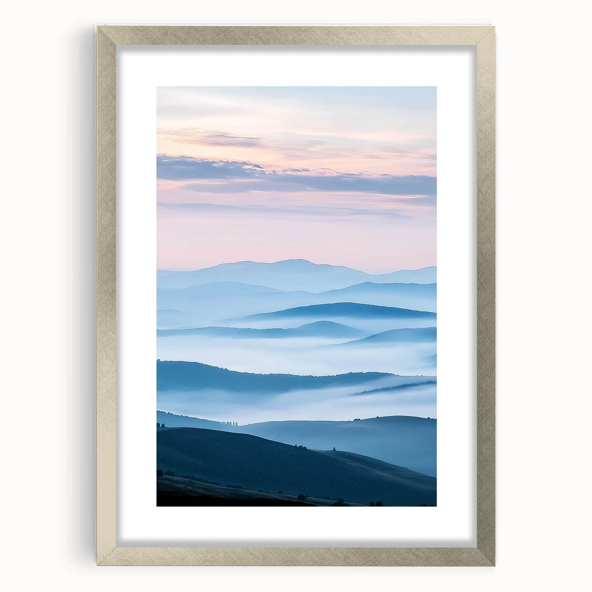 Silver-framed landscape artwork showcasing a serene countryside scene with lush greenery and rolling hills, enhanced by a white mat for a polished presentation. Perfect for home decor or gallery displays.