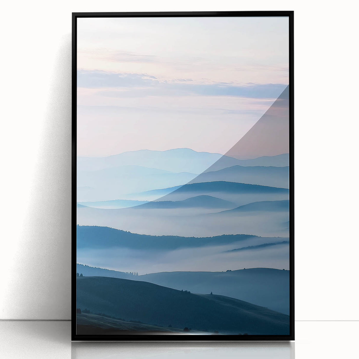 Framed acrylic landscape artwork showcasing a serene countryside scene, featuring lush green fields and a vibrant blue sky, set in a sleek black frame.