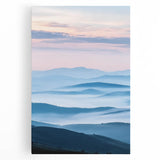 Stretched canvas artwork depicting a serene countryside landscape with vibrant green fields and a clear blue sky, ideal for home decor in natural themes.
