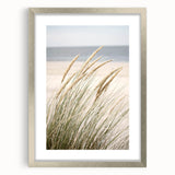 Textured abstract art print in silver frame, featuring dynamic swirls in warm hues, ideal for bedroom ambiance.