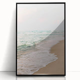 Large abstract wall art in vibrant orange and blue tones on a black acrylic frame, ideal for modern living room decor.