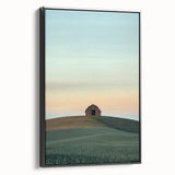 Framed canvas print of a serene countryside landscape showcasing lush green fields, rolling hills, and a vibrant sky with soft clouds, presented in a sleek black frame. Perfect for home decor enthusiasts seeking nature-inspired art.