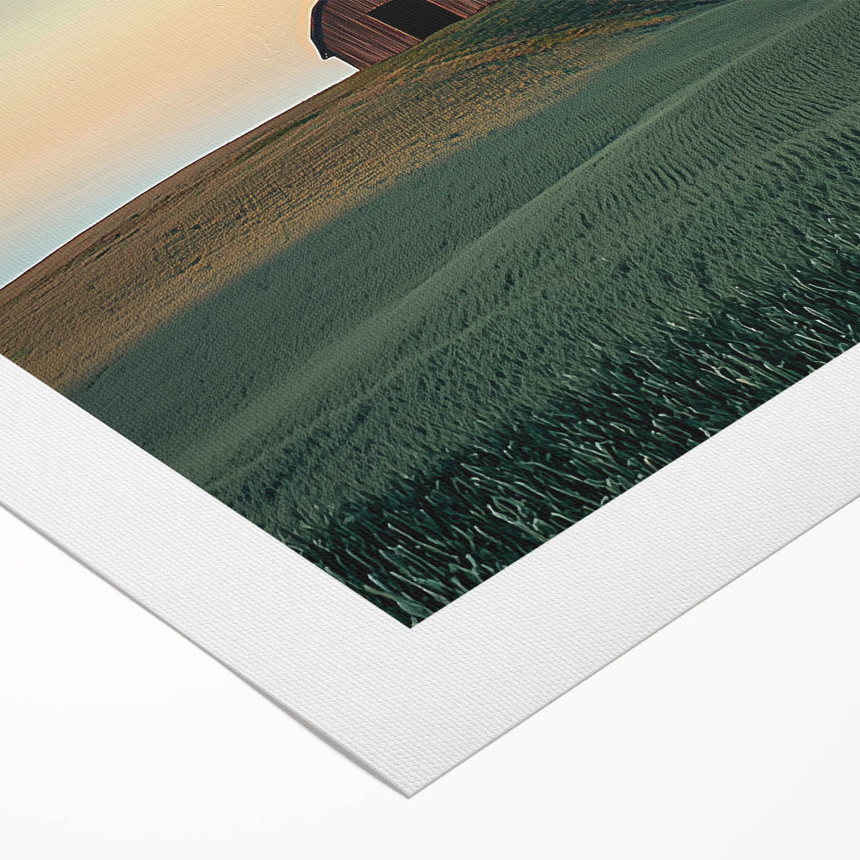 Rolled canvas artwork depicting a serene countryside landscape with vibrant green fields and a blue sky, elegantly packaged in a protective cardboard tube for easy transport.
