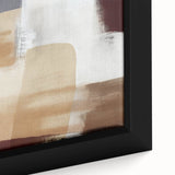 Close-up of a framed canvas wall art piece showcasing vibrant abstract strokes in shades of blue, orange, and yellow, adding a modern touch to home decor.