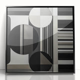 Framed acrylic wall art featuring an abstract geometric design in black, showcasing sharp angles and modern aesthetics, ideal for contemporary decor.