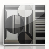 Framed abstract geometric art piece in white acrylic, showcasing bold shapes and lines, perfect for modern home decor and enhancing minimalist interiors.