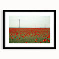 Black-framed landscape artwork showcasing a serene countryside scene with vibrant greenery and rolling hills, designed to enhance home decor aesthetics.