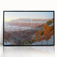 Framed acrylic artwork depicting a stunning landscape of rugged cliffs, featuring a black frame that enhances the vibrant colors and intricate details, perfect for modern home decor.