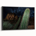 Framed canvas artwork showcasing a stunning landscape of canyons in rich earth tones, with a sleek black frame, ideal for enhancing modern home decor.