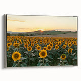 Framed canvas artwork depicting a serene countryside landscape, featuring lush green fields and a tranquil blue sky, with a sleek silver frame enhancing its elegance.