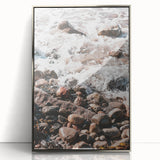 Mid-century modernist art depicting a serene beach scene in pastel shades on a silver-framed acrylic print.