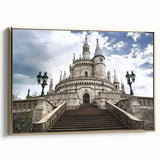 Framed canvas artwork showcasing a detailed landscape of a majestic castle surrounded by lush greenery, set in a gold frame that enhances its elegance. The side view highlights the texture and quality of the canvas, perfect for home decor enthusiasts seeking classic art pieces.