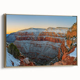 Framed canvas artwork depicting a serene landscape of cliffs and ocean waves, featuring a gold border. Ideal for modern home decor and art enthusiasts.
