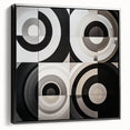 Abstract geometric framed canvas artwork in black, showcasing intricate shapes and lines, ideal for modern home decor. Side view highlights sleek frame and textured details.
