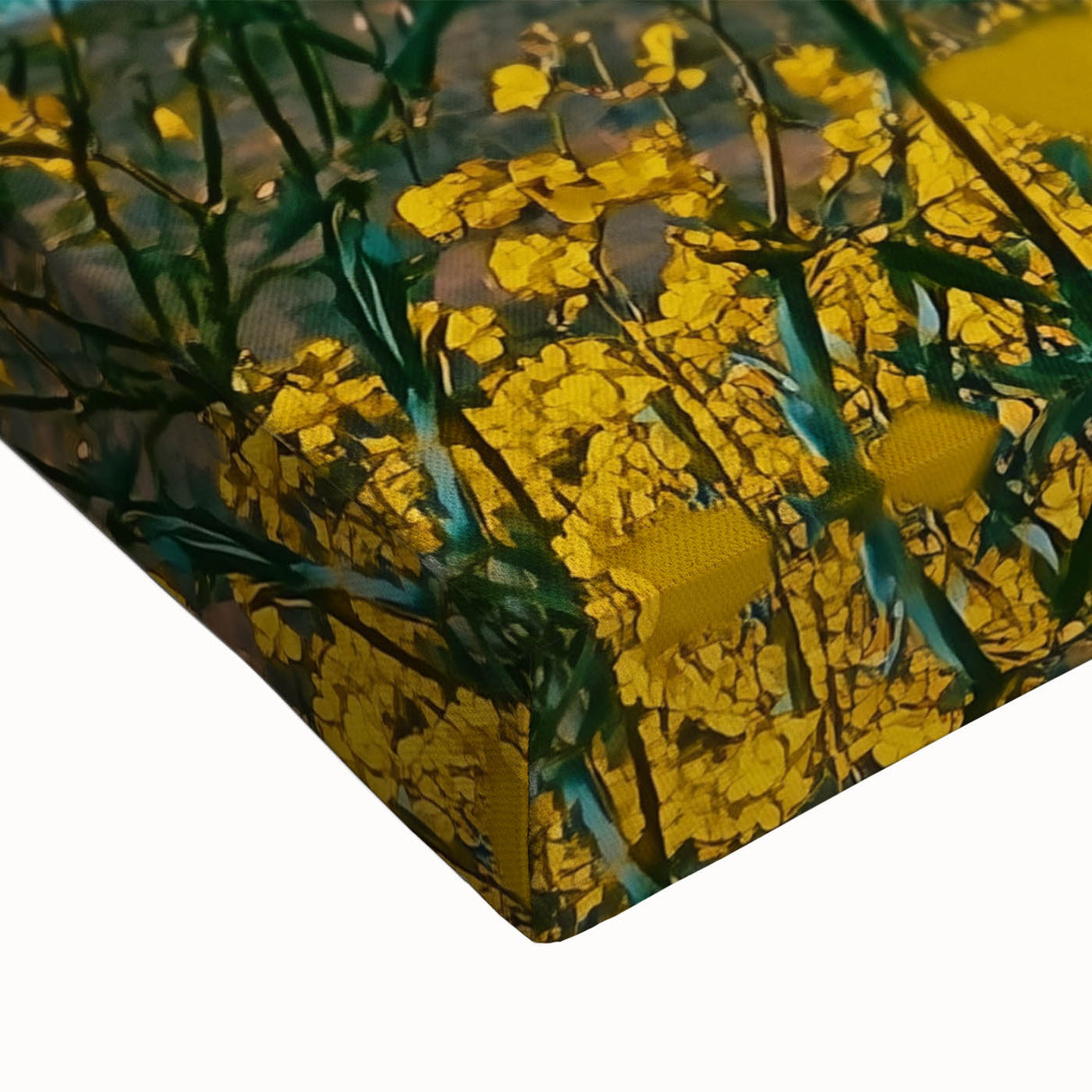 Close-up of a vibrant stretched canvas artwork depicting a serene countryside landscape with lush green hills and a bright blue sky, ideal for home decor.