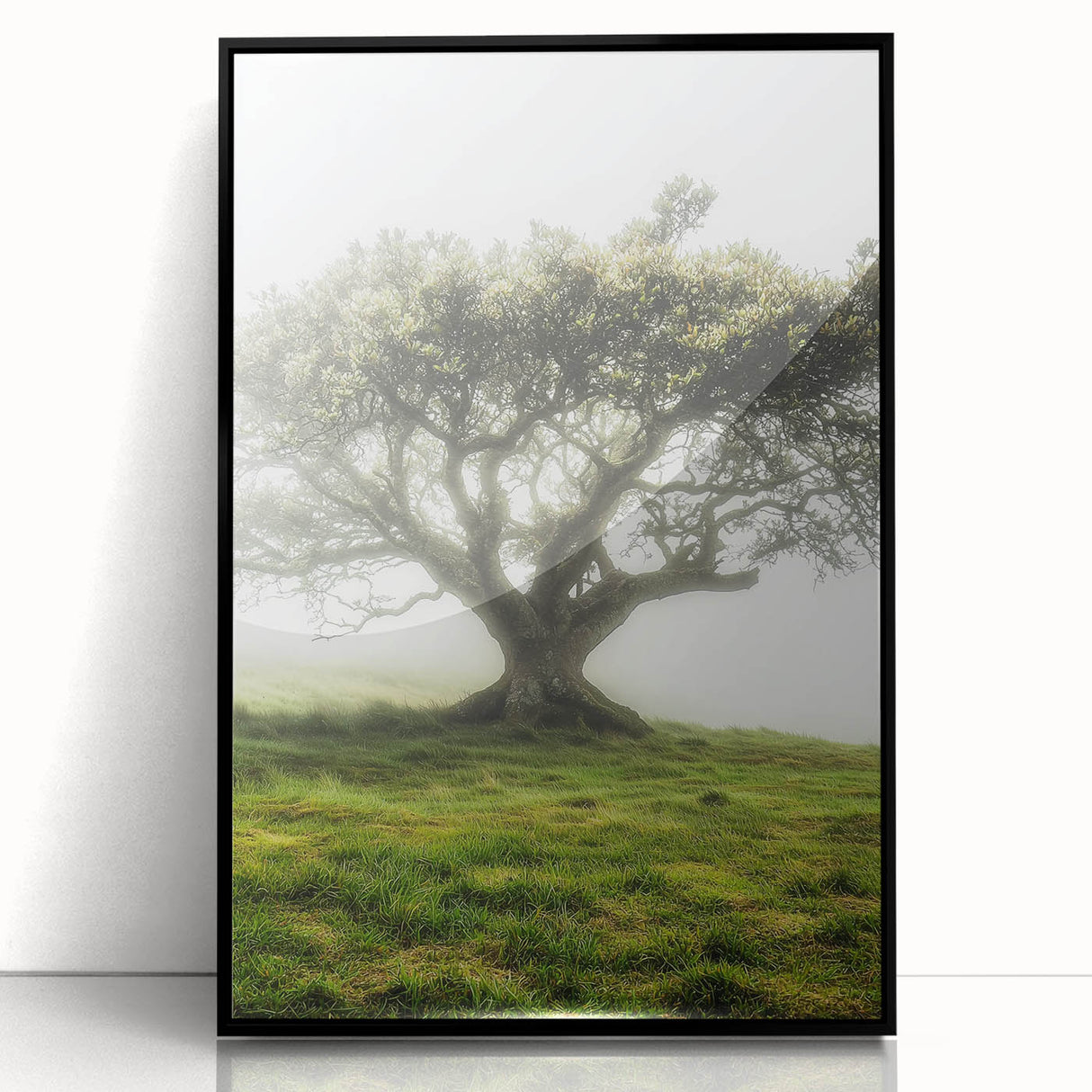 Framed acrylic artwork showcasing a picturesque countryside landscape with vibrant greenery and rolling hills, presented in a sleek black frame for modern decor.