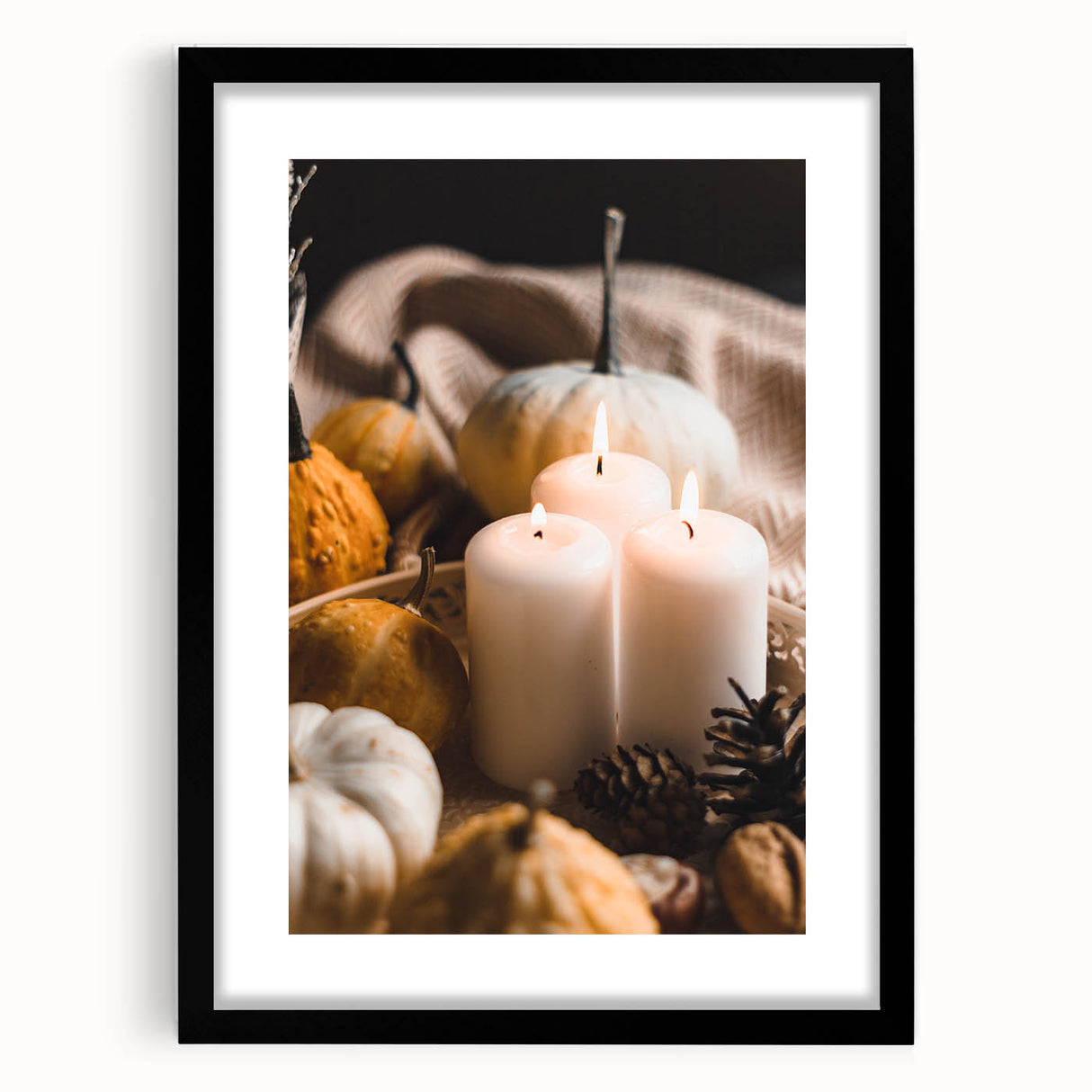 Abstract art print featuring textured, colorful autumn leaves in a large black frame, ideal for living room decor.