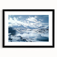 Black frame with a white mat showcasing a serene countryside landscape painting, emphasizing vibrant greens and blues, perfect for home decor.