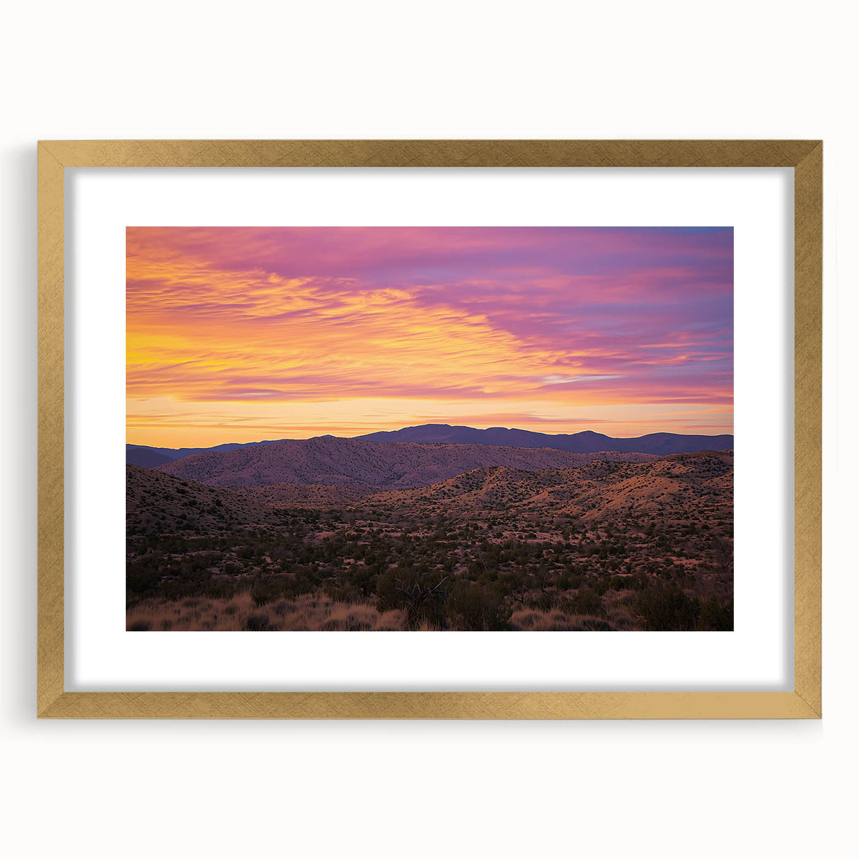 Framed desert landscape artwork with a gold mat, showcasing vibrant colors and intricate details, perfect for home decor and adding a touch of elegance.