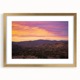 Framed desert landscape artwork with a gold mat, showcasing vibrant colors and intricate details, perfect for home decor and adding a touch of elegance.