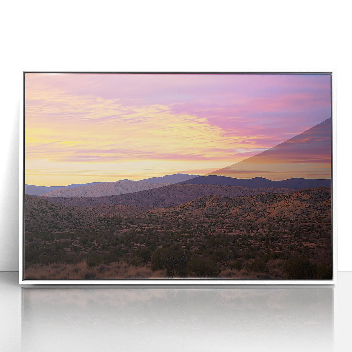 Framed acrylic artwork depicting a serene desert landscape with warm hues of orange and gold, showcasing a minimalist style and contemporary white frame. Ideal for modern home decor.