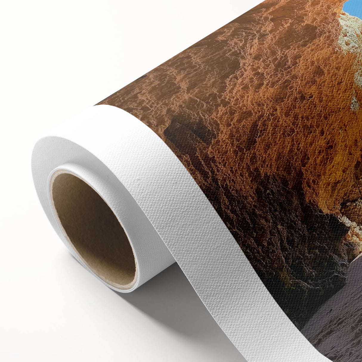 Vibrant rolled canvas artwork depicting a serene beach landscape with turquoise waters, golden sands, and lush greenery, perfect for coastal decor.