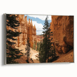 Framed canvas artwork showcasing a stunning landscape of canyons in vibrant colors, elegantly mounted with a sleek silver frame, perfect for home decor.