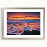 Framed landscape artwork depicting serene beaches, featuring a silver mat and elegant frame, perfect for coastal-themed home decor and interior design.