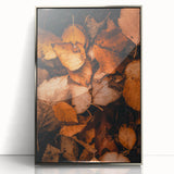 Mid-century modernist art depicting fall trees in orange and brown hues on a framed acrylic print.
