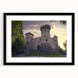 Elegant black-framed landscape artwork showcasing a majestic castle surrounded by lush greenery, presented with a white mat for a refined look. Perfect for enhancing home decor with a classic touch.