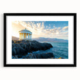 Black-framed landscape print showcasing majestic cliffs with vibrant colors and a textured mat background, perfect for home decor enhancement.