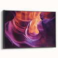 Framed canvas artwork depicting a stunning landscape of canyons in rich earth tones, featuring a black frame that enhances its vibrant details, perfect for home décor.