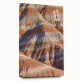 Acrylic landscape artwork showcasing dramatic cliffs in vibrant colors, displayed in a sleek glass frame, emphasizing depth and detail for modern decor.