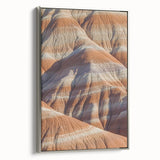 Framed canvas depicting a stunning landscape of rugged cliffs under a blue sky, showcasing silver accents. Ideal for modern home decor or office settings.