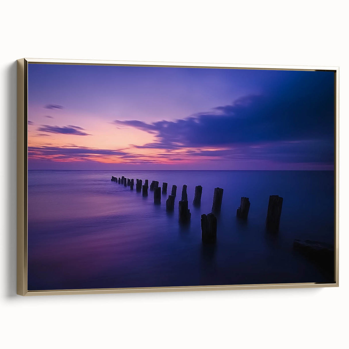 Framed canvas art depicting a serene beach landscape with soft golden hues, showcasing gentle waves and palm trees, ideal for coastal home decor.