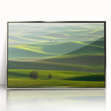 Framed acrylic artwork showcasing a serene countryside landscape with vibrant greens and blues, elegantly displayed with a silver frame, perfect for home decor.