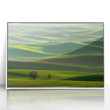 Framed acrylic artwork depicting a serene countryside landscape with vibrant green fields and a clear blue sky, elegantly showcased in a white frame for a modern home decor aesthetic.
