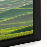 Framed canvas art showcasing a vibrant countryside landscape with rolling hills and a clear blue sky, adding natural beauty to home decor.