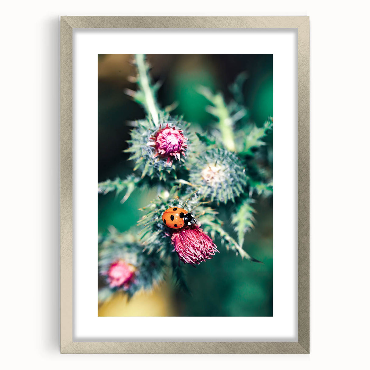 Abstract textured art print in soft blue and green tones, framed in silver, ideal for bedroom wall decor.